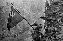 Raising_a_flag_over_the_Reichstag_2.jpg